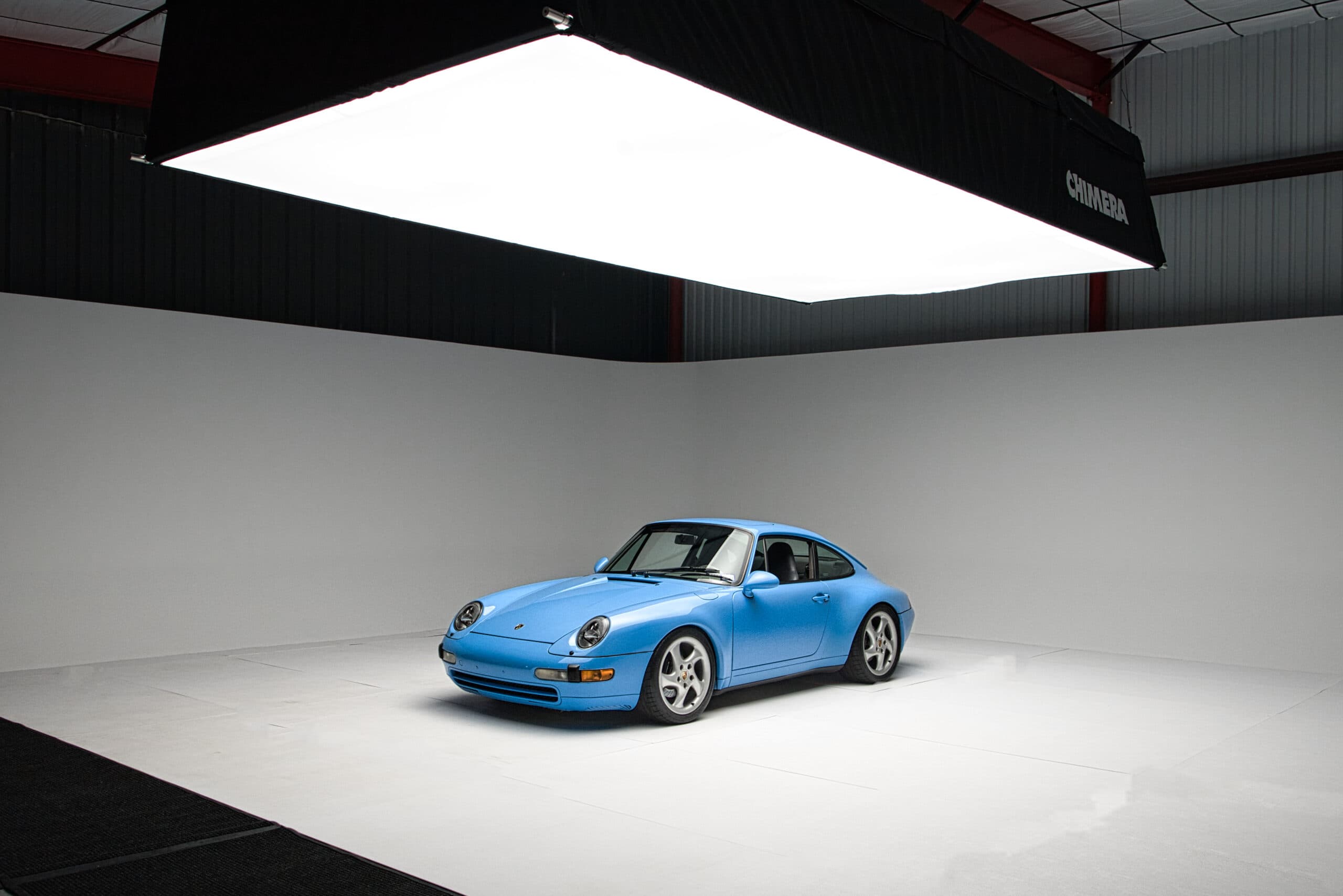 Professional automotive photography with studio lighting