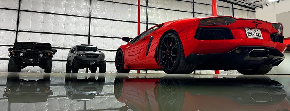 Luxury vehicles including Lamborghini ready for concierge services at The Asylum